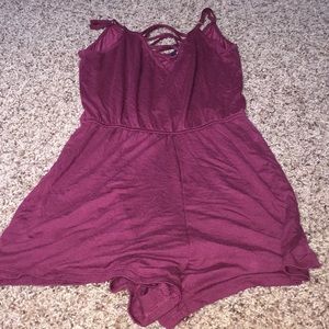 maroon romper with criss/cross on front
